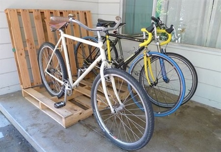 Bikes parked in wood pallet bike rack