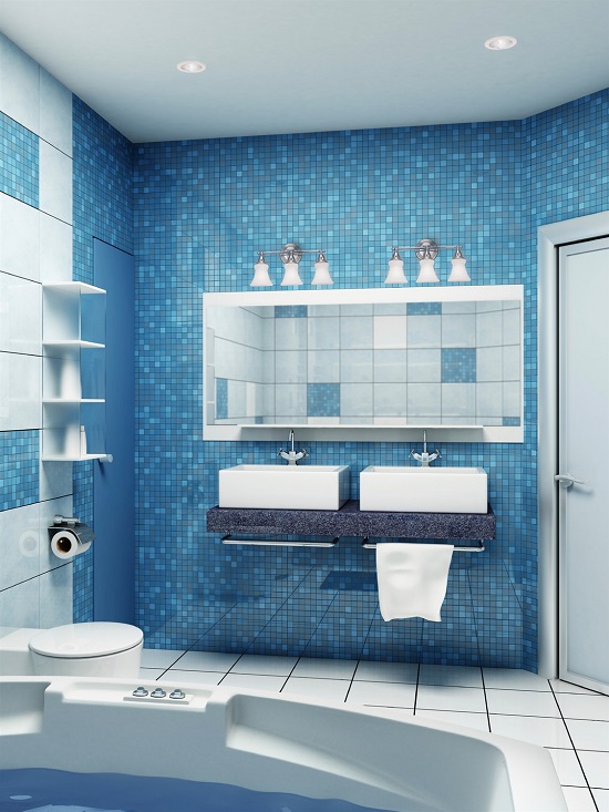 Bright blue bathroom with double sinks and vanity lights over either side of the mirror.