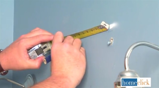 Marking points on the wall using pencil and tape measure
