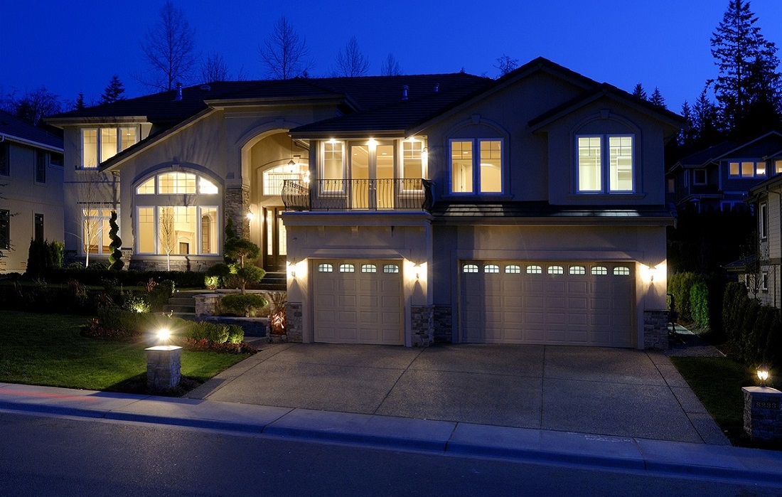 Home Decor And Improvement Lighting Well Lit Two Story House During The Evening