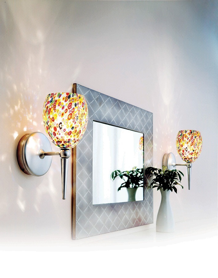 Bright multi-colored wall sconces on either side of a mirror